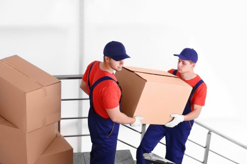 Packed boxes and furniture ready for transport in Lea Bridge