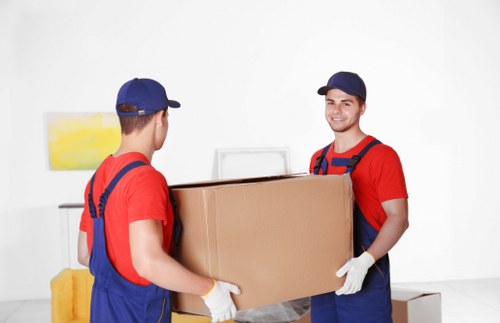 Local office movers handling desks and boxes near Lea Bridge