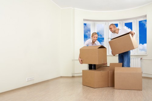Staff using protective gloves and hi-vis PPE during a house move