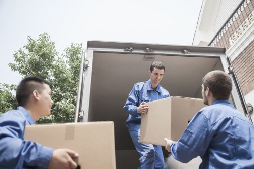Careful loading of household items for a move in Lea Bridge