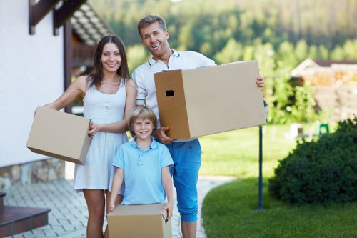 Packed moving boxes and furniture for a local house move