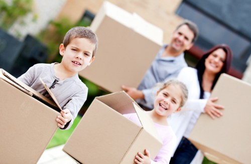 Professional man and van service handling boxes and furniture in Lea Bridge