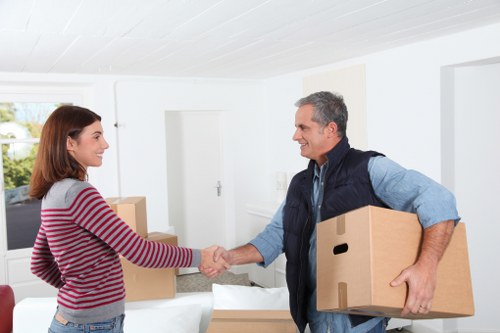 Loading furniture into a moving truck in Lea Bridge