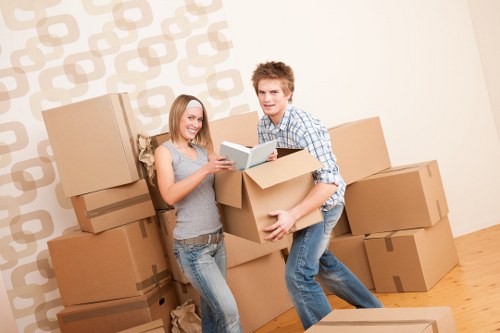 Packed moving boxes and furniture ready for local removals in Lea Bridge