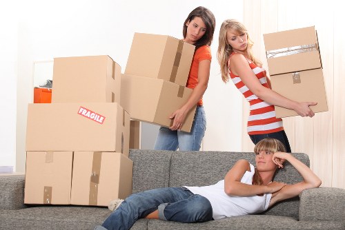 Professional movers loading a van for a Lea Bridge relocation
