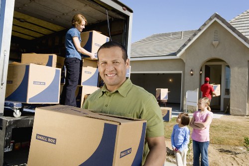 Careful loading of boxes and furniture for a Lea Bridge house move